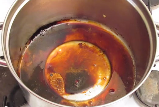 A saucepan with burnt on sugar