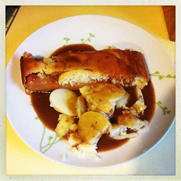 Toad in the hole. Sausages baked in Yorkshire pudding batter.